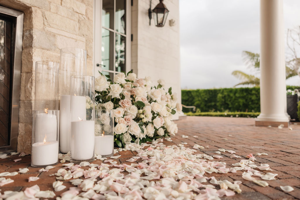 Elegant proposal decorations featuring white florals and glowing candlelight