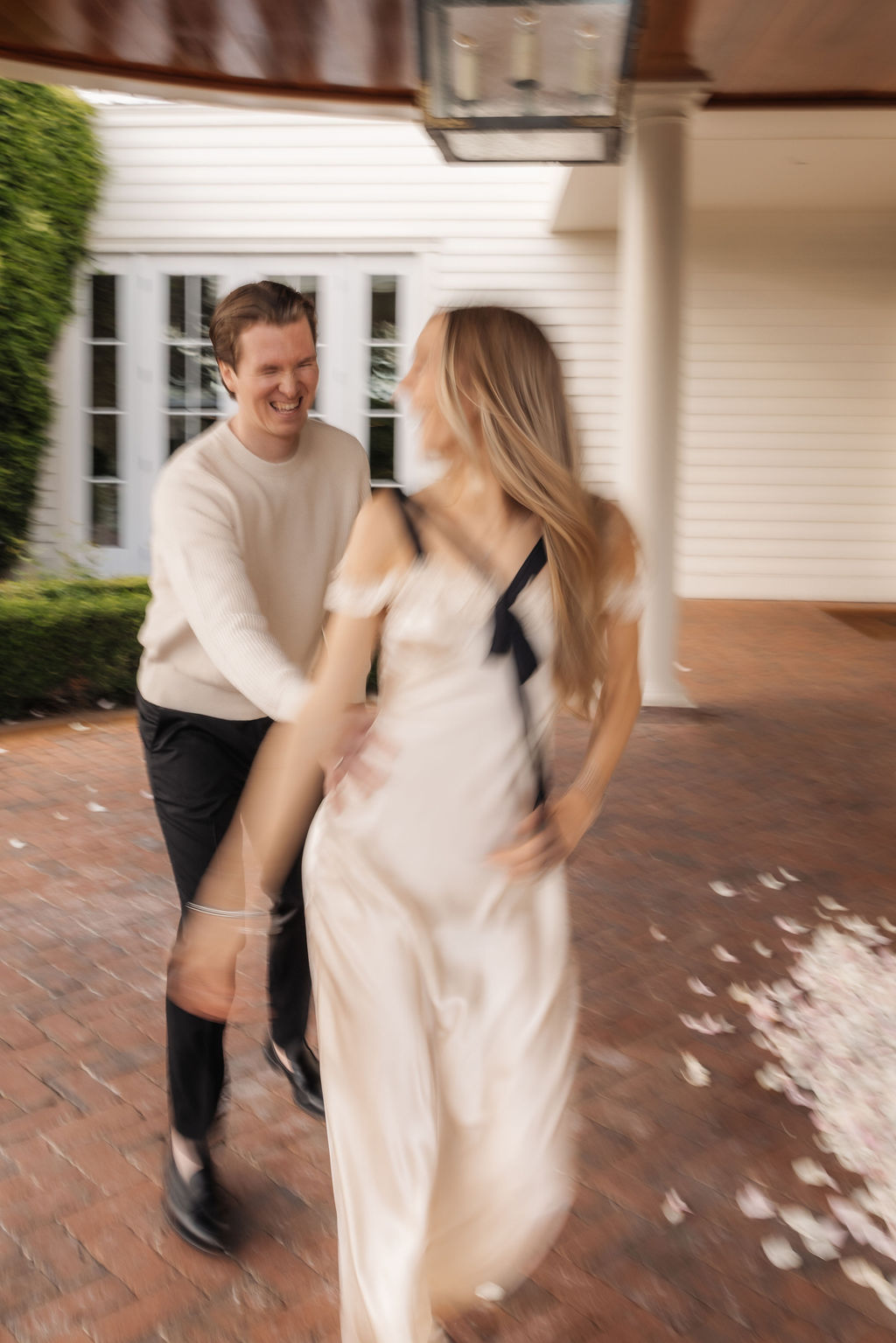 Trendy motion film blur of a couple celebrating after their Montecito proposal