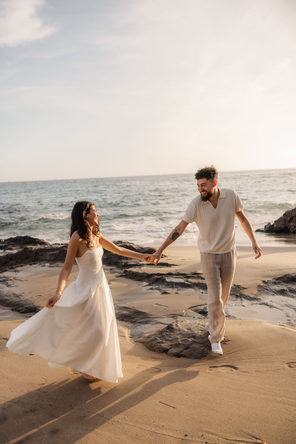 Playful and fun engagement photo prompts on the beach by Ventura proposal photographer
