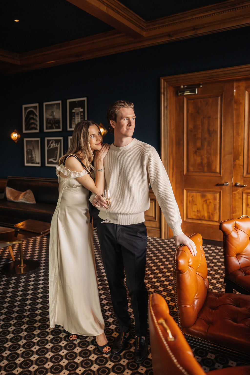 Dramatic indoor couple portraits utilizing rich wood backbones and textures
