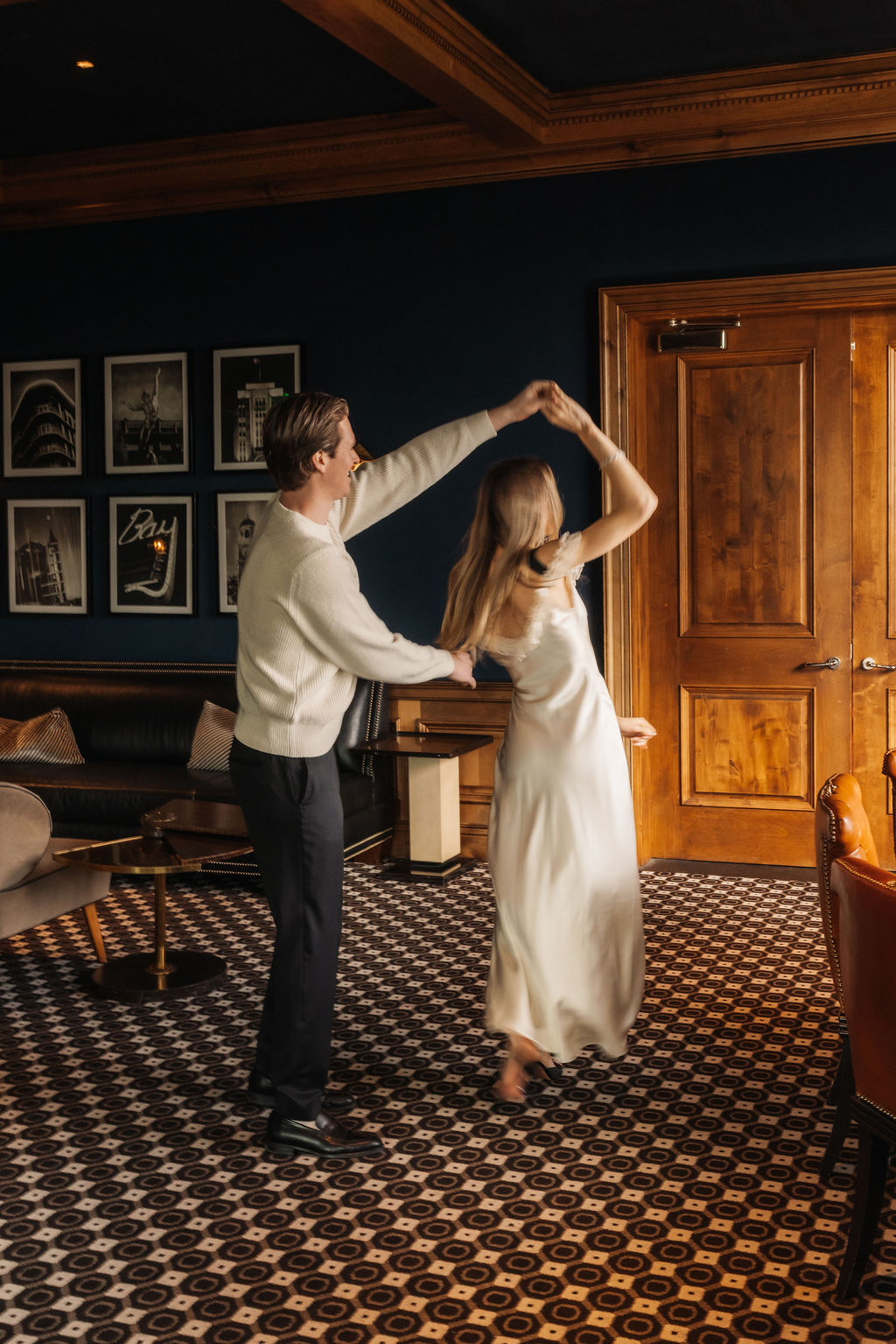 Joyful couple spinning together during their Rosewood Miramar proposal celebration