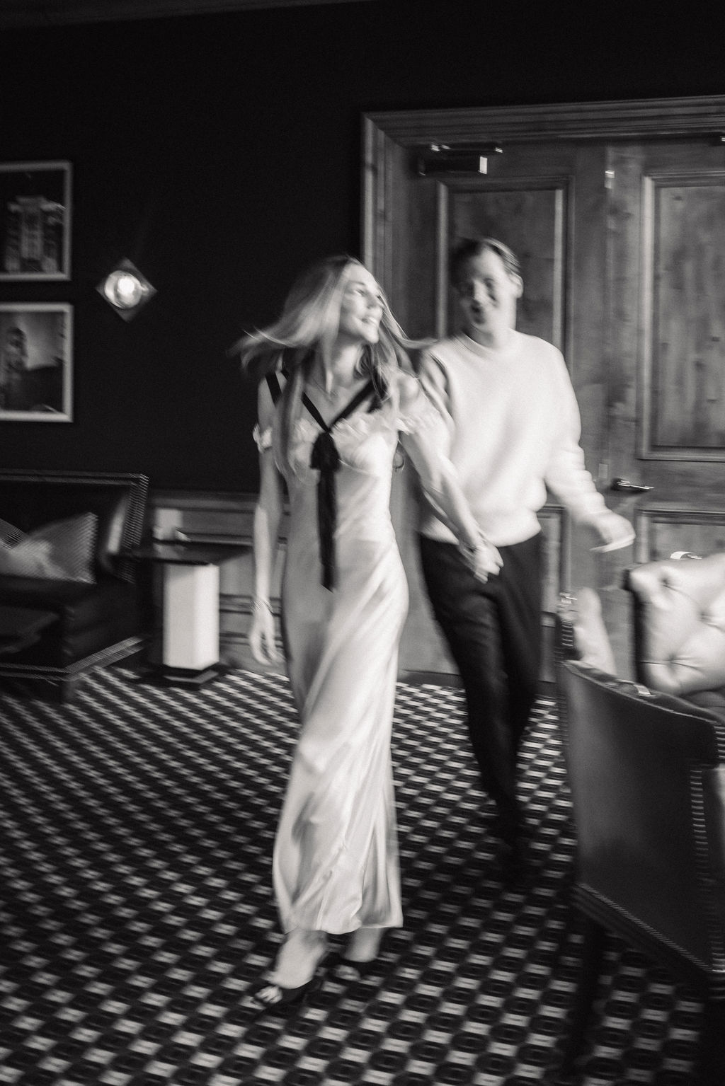 Playful cinematic movement shot utilizing available light and slow shutter speed inside the room