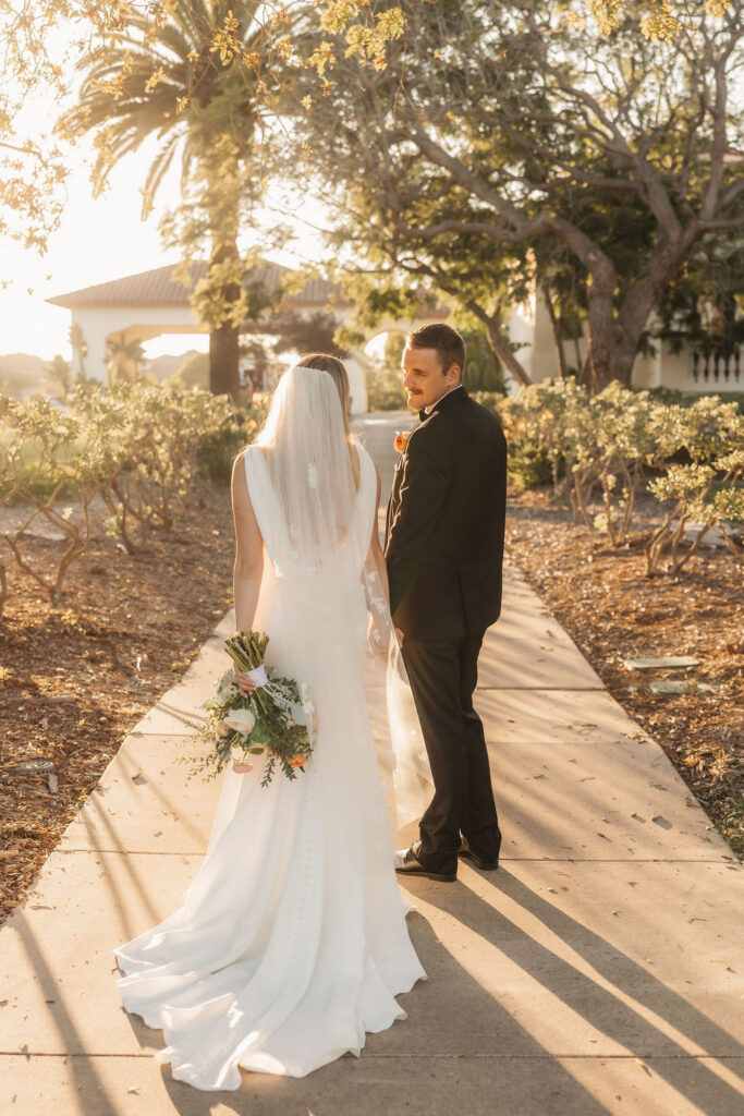 Candid moments during a romantic sunset wedding ceremony in Camarillo
